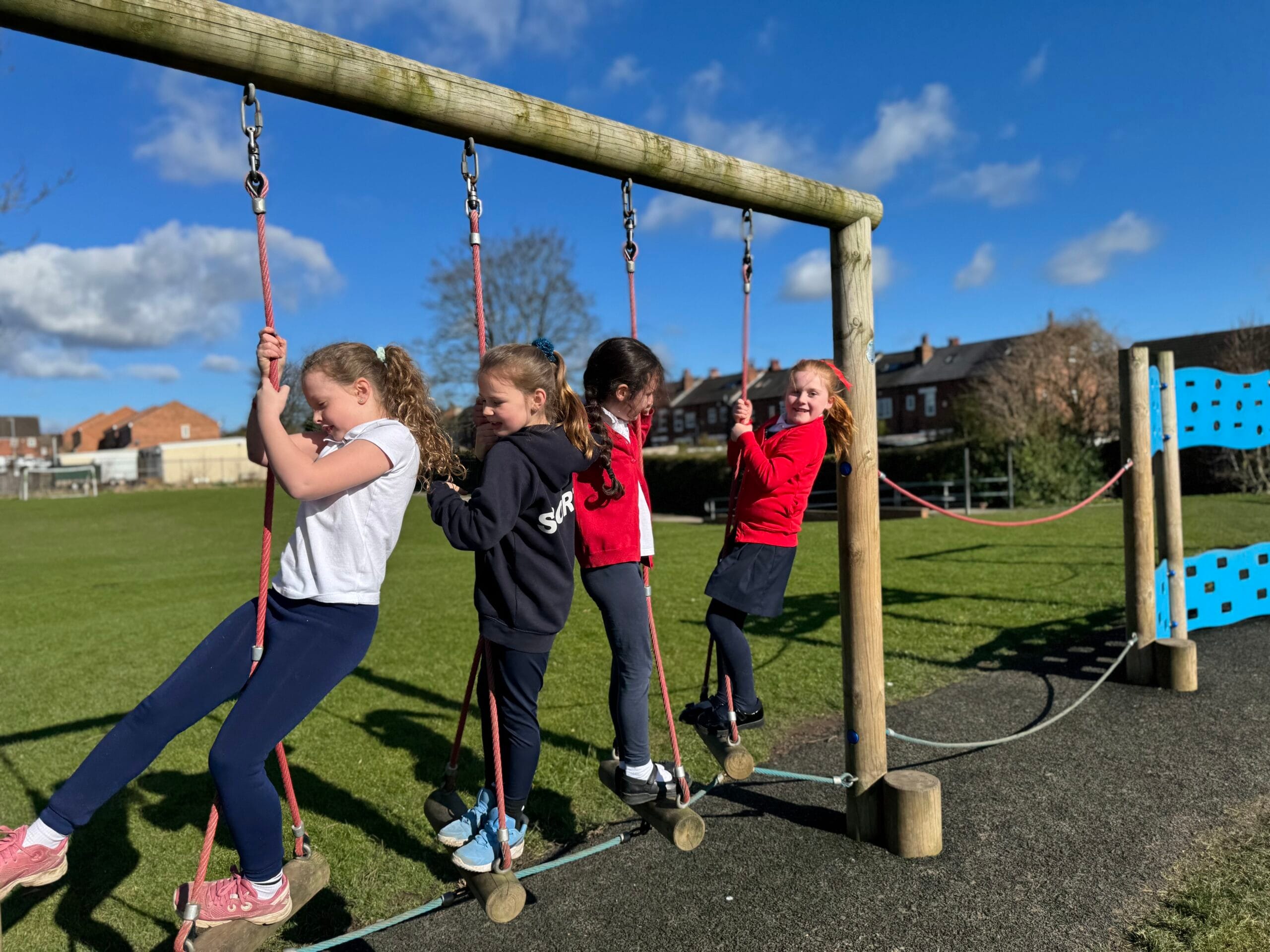 Girls playing on swings